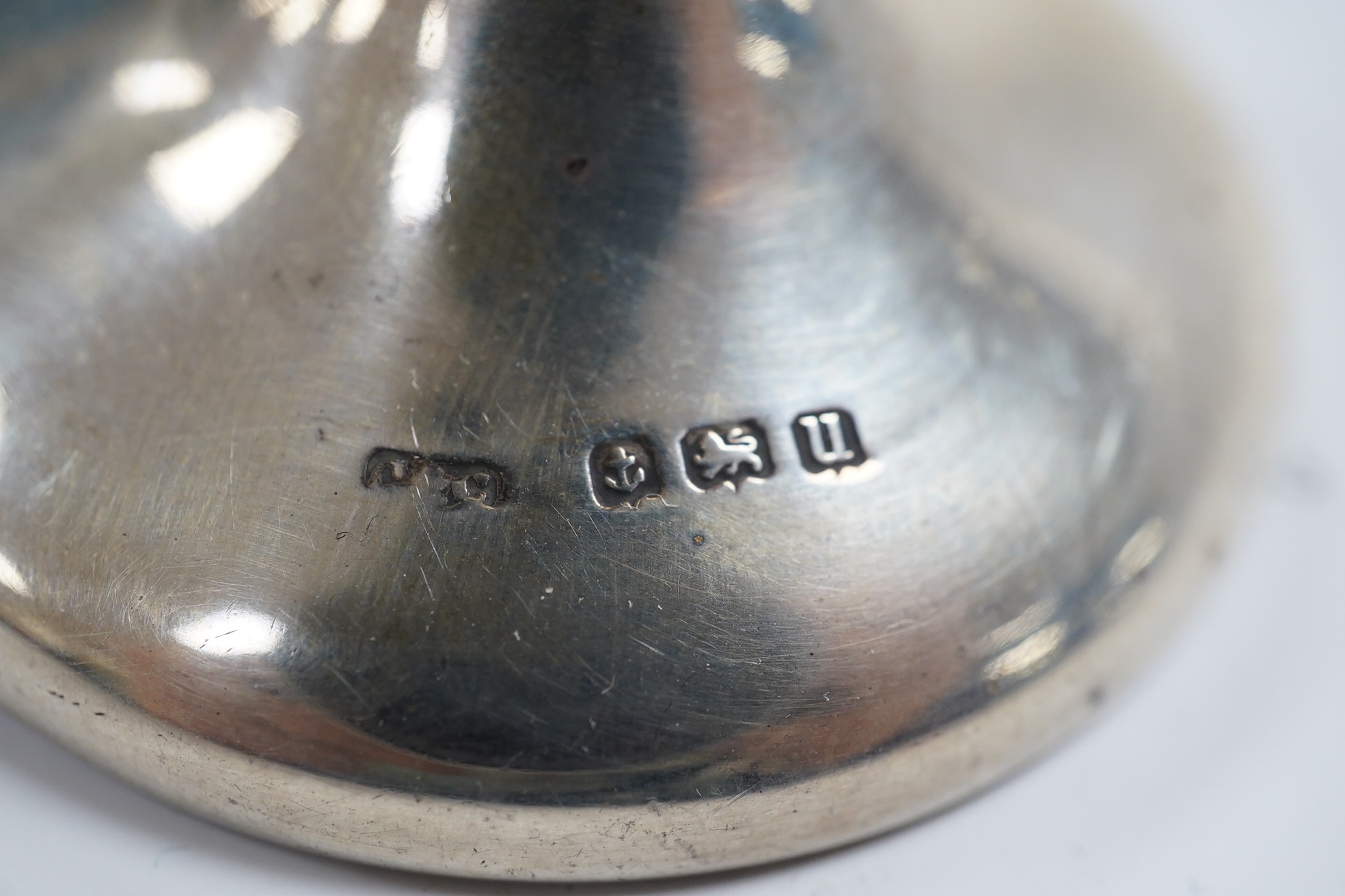 A cased set of eight George V silver grapefruit spoons, Sheffield, 1933 and a pair of silver spill vases, 17.5cm. Condition - poor to fair